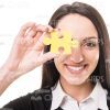 Lady Covering Her Eye With Yellow Piece Of Puzzle Stock Photo