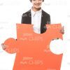 Pretty Young Businesswoman Holding Big Piece Of Puzzle Stock Photo