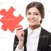Happy Businesswoman Holding Jigsaw Puzzle Stock Photo