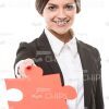 Handsome Businesswoman Offers Big Puzzle Piece Stock Photo