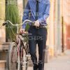 Smiling Man Walking On The Street With His Bike Stock Photo