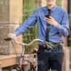 Nice Young Businessman Using The Phone And Holding His Bicycle Stock Photo