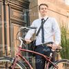 Nice Business Man Holding Bicycle With Both Hands Stock Photo