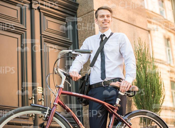 Nice Business Man Holding Bicycle With Both Hands Stock Photo
