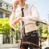 Friendly Man Leaning On Bike While Talking The Phone Stock Photo