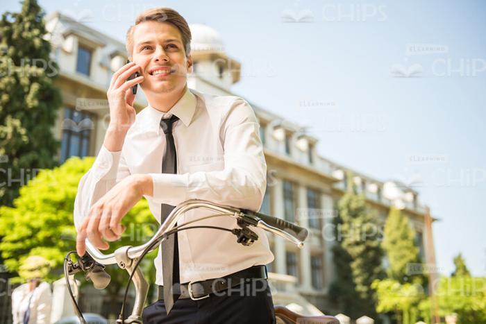Confident Young Guy Holding The Phone Conversation Stock Photo