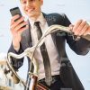 Happy Guy Typing Message And Leaning On Bicycle Stock Photo