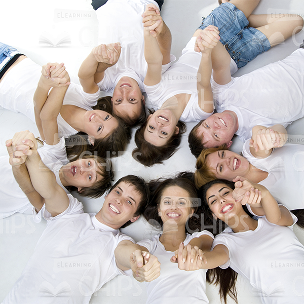 Happy Young People Holding Hands Stock Photo