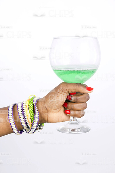 Woman's Hand Holding Glass Stock Photo-0