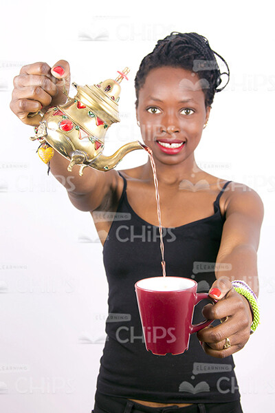 Happy African Woman With Teapot Stock Photo-0