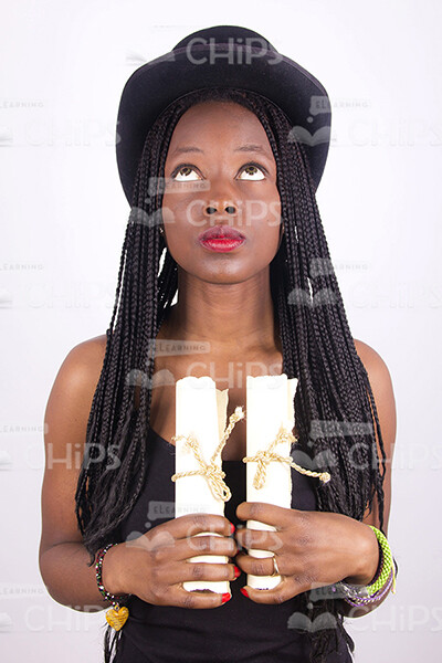 African Young Woman Holding Two Scrolls Stock Photo-0