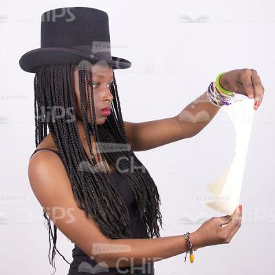Half-Turned African Young Woman Reading Scroll Stock Photo-0