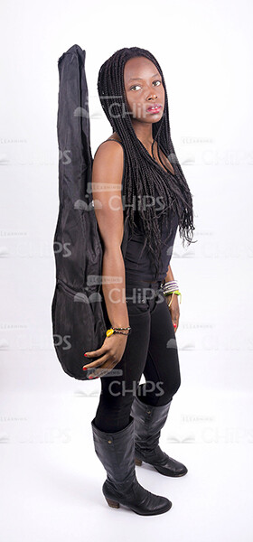 Stock Photo Of Half-Turned African Woman With Guitar Case-0
