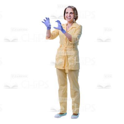 Attractive Physician Gesturing With Both Hands In Sterile Gloves Cut Out Image-0