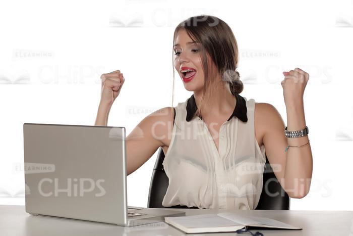 Happy Businesswoman Sitting At Workplace And Making Yes Gesture Stock Photo-0