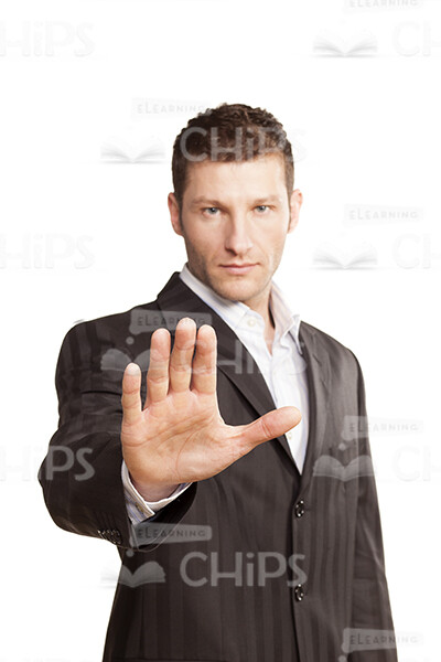 Serious Young Businessman Making Stop Gesture-0