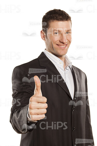 Smiling Businessman Showing His Thumb Up Stock Photo-0
