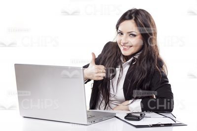 Smiling Business Woman Sitting Behind Table And Showing Thumb Up Stock Image-0