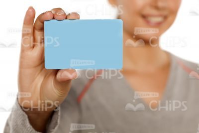 Light Blue Card Sample In Woman's Hand Close Up Stock Photo-0