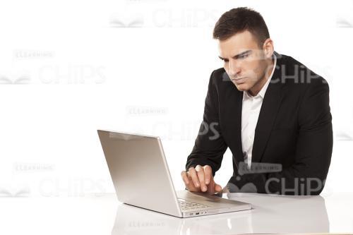 Young Man Working On Laptop Stock Photo-0