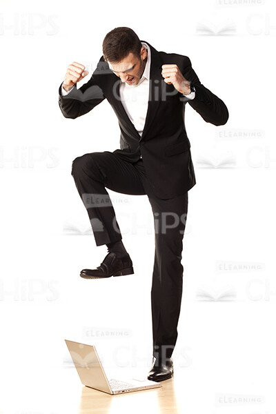 Angry Business Man Going To Break The Laptop Stock Photo-0