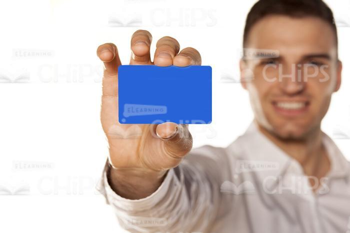 Young Man Presenting Card Sample Stock Photo-0