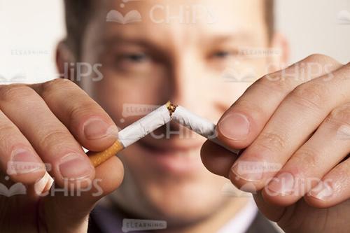 Business Man Breaking Cigarette Stock Photo Pack-31834
