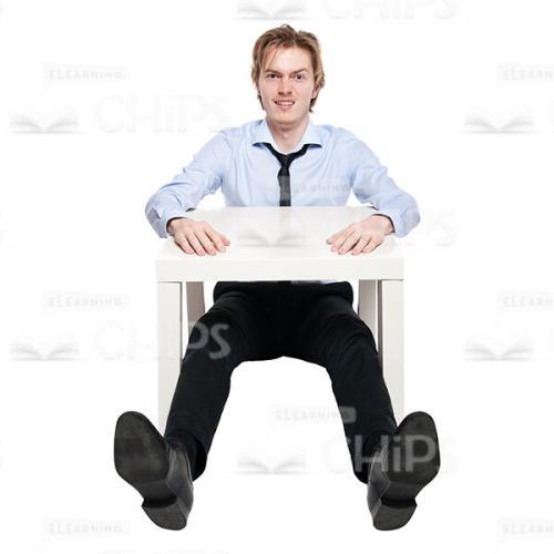 Young Handsome Confused Man Sitting At Table Cutout Photo-0