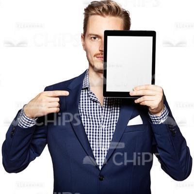 Cutout Photo of a Serious Young Man in Dark Blue Suit Covering Part of His Face with the Tablet and Pointing at It-0