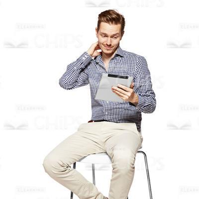 Puzzled Young Man Looking At Tablet Cutout Photo-0