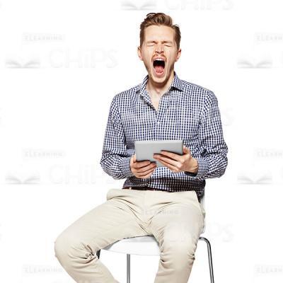 Widely Yawning Young Man With Tablet Cutout Photo-0