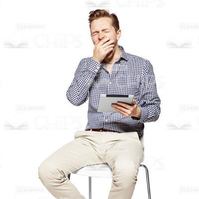 Yawning Young Man With Tablet Cutout Photo-0