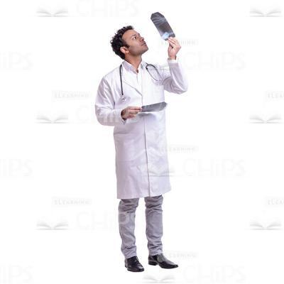 Cutout Picture of Serious Doctor Examining X-Ray in the Light-0