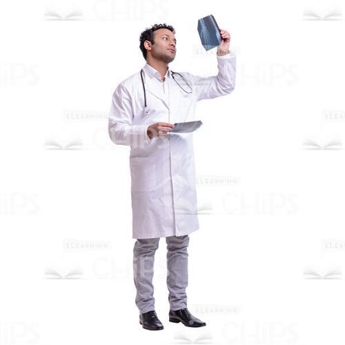 Cutout Image of Young Doctor Looking at X-Ray in the Light-0