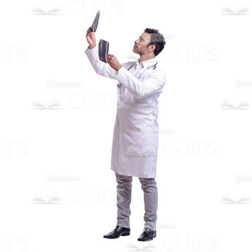 Cutout Image of Young Doctor Comparing Two X-rays-0