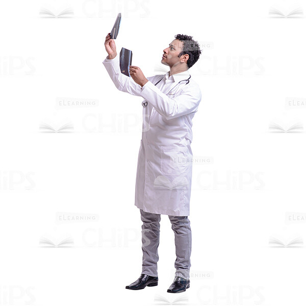 Cutout Image of Young Doctor Comparing Two X-rays-0 Cutout Image of Young Doctor Comparing Two X-rays-0