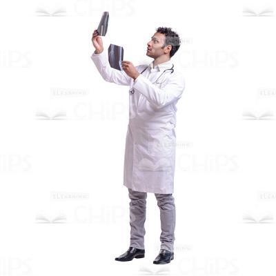 Cutout Photo of Thoughtful Doctor Considering One of Two X-rays-0