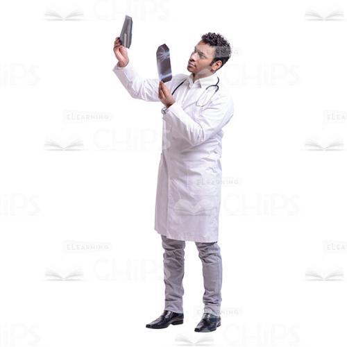 Cutout Photo of Thoughtful Doctor Comparing X-rays-0