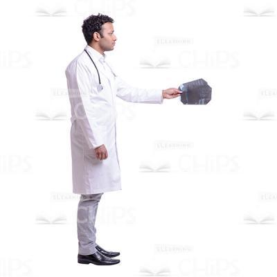 Cutout Image of Serious Doctor Giving Two X-rays to Someone-0