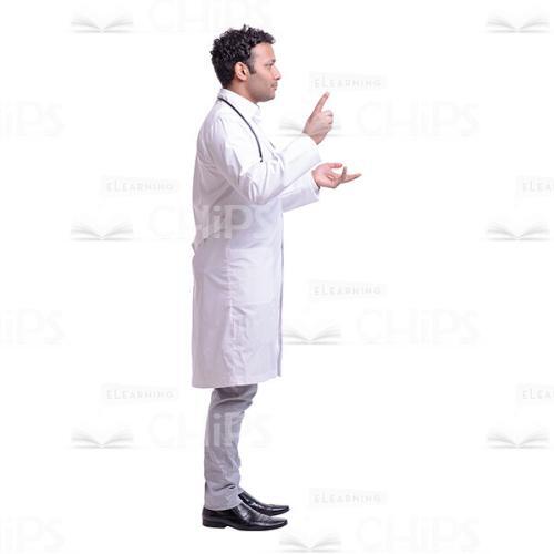 Cutout Image of Handsome Young Doctor Showing Something with his Forefinger-0