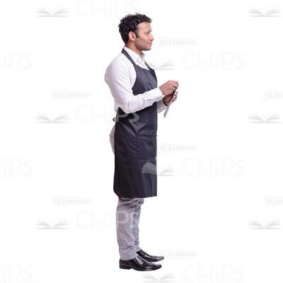 Cutout Image of Positive Waiter Standing Half Turned and Holding a Notepad -0