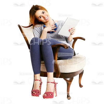 Pleased Lady With Tablet Sitting On Chair Cutout Image-0
