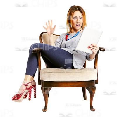 Sitting Surprised Young Woman Looking At The Tablet Cutout Image-0