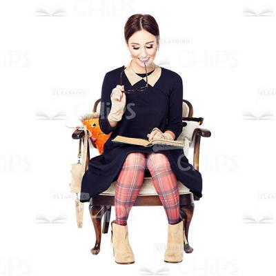 Cutout Image of Amused Young Woman Sitting in Armchair and Reading a Book-0