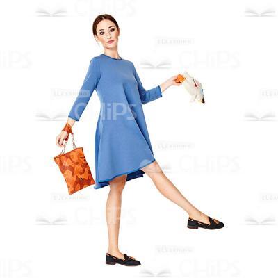 Cutout Image of Pretty Young Woman in a Blue Dress Making Step Ahead-0
