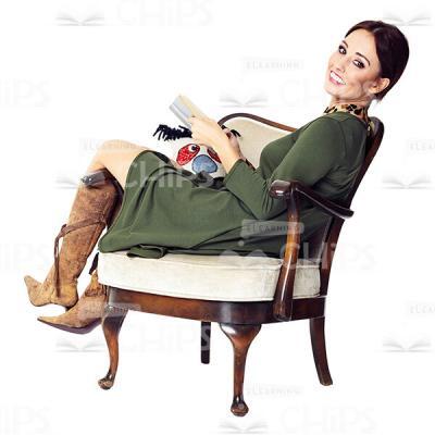 Cutout Character of a Smiling Young Woman in a Green Dress Sitting Half-Turned in the Armchair-0