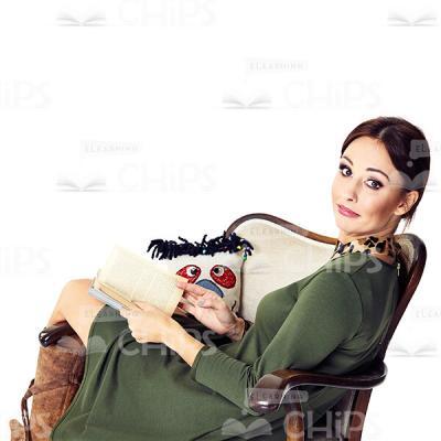 Cutout Character of a Thoughtful Young Woman in a Green Dress Sitting Sideways in the Armchair-0