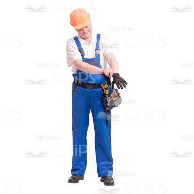 Cutout Photo of Middle-aged Constructor in Orange Hard Hat Put on a Work Glove on a Left Hand -0
