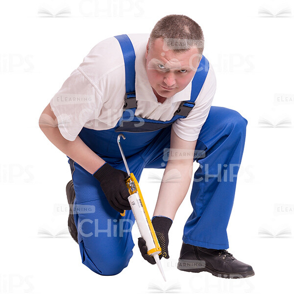 Cutout Image Of Crouching Worker Using Construction Syringe Gun-0