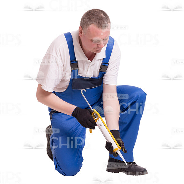 Satisfied Worker Crouching And Using Builder Syringe Cutout Image-0